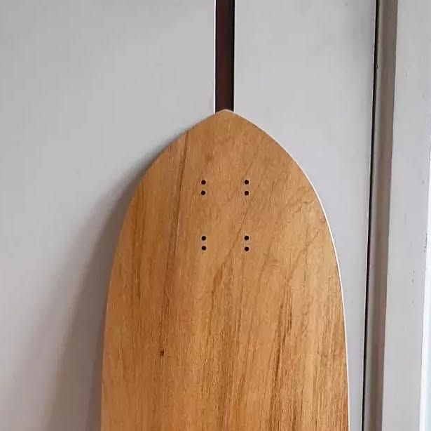 Pintail deck tail detail — natural wood grain
